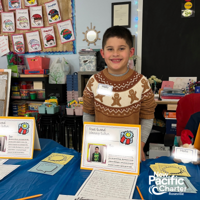 a young student showcasing this school work