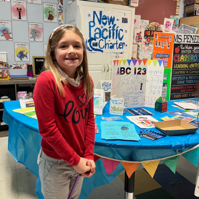 young student showcasing her school project